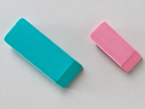 Top View of Green and Pink Erasers isolated on White Background with Real Shadow. Close up.