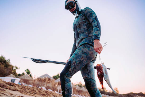 istock back from spear fishing 899214128