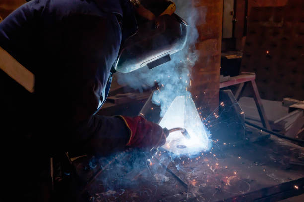 istock Semi-automatic welding of metal structures in the shop 899217946