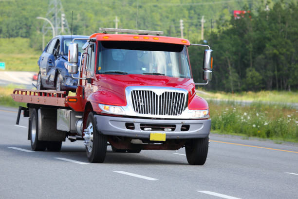 istock Tow truck on a highway with vehicle with damage. 899218062