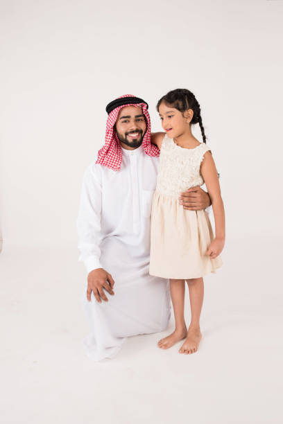 istock Arab father with his daughter on white background 899219254