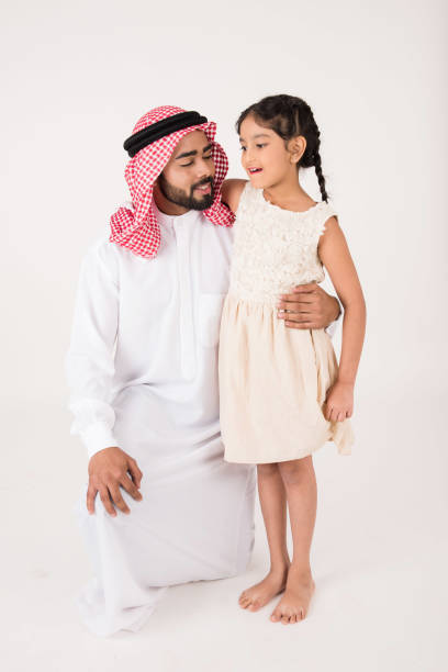 istock Arab father with his daughter on white background 899219260