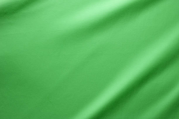 Cotton Clothing Fabric Texture Background. Cotton Fabric Full Frame Texture. Top View of Cloth Textile Surface. Green Clothing Background. Text Space textile industry stock pictures, royalty-free photos & images