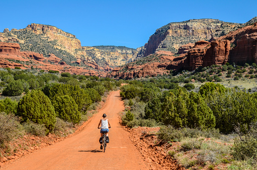 a senior male riding a fat mountain bike on a single track trail in Red Mountain Open Space in Colorado, fall scenery