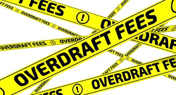 Overdraft fees. Yellow warning tapes stock photo