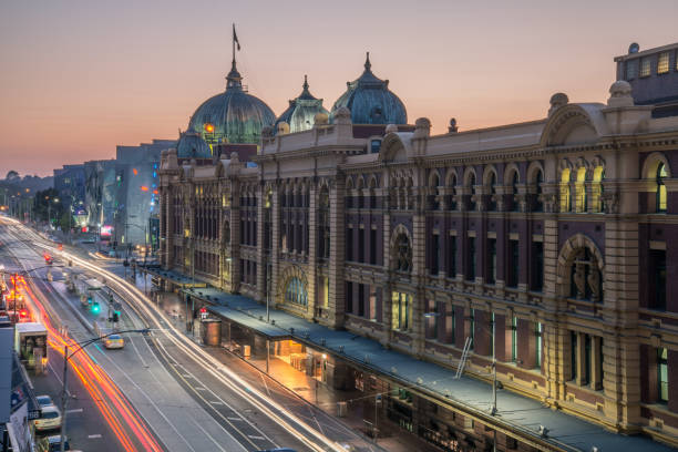 flinders street station the iconic landmark of melbourne at dawn, australia. - melbourne cityscape clear sky day imagens e fotografias de stock