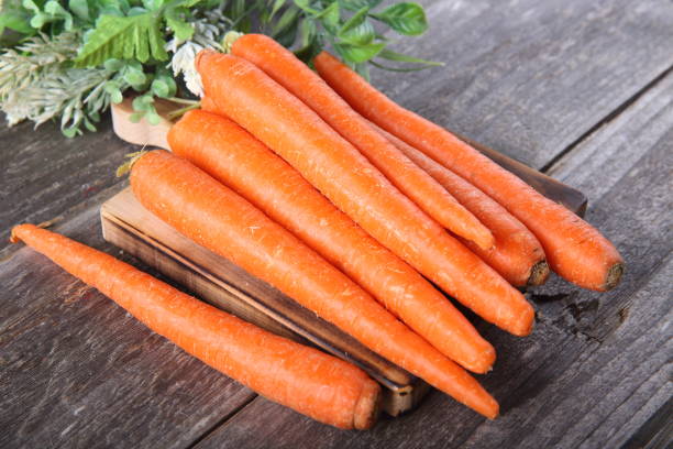 istock Carrots on a wooden table 899240092