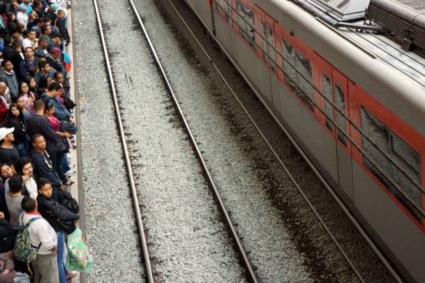 istock People waiting for ther train at a busy train station 899243784