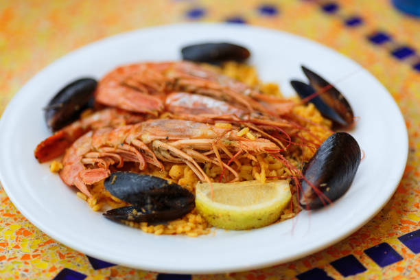 istock Paella. Rice with king prawns and mussels 899246954