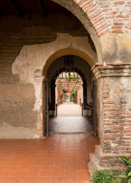 istock Arches and pathway in San Juan Capistrano mission 899251176
