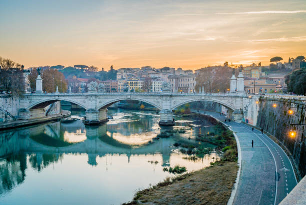 istock Sunset over the Tiber river in Rome 899254880