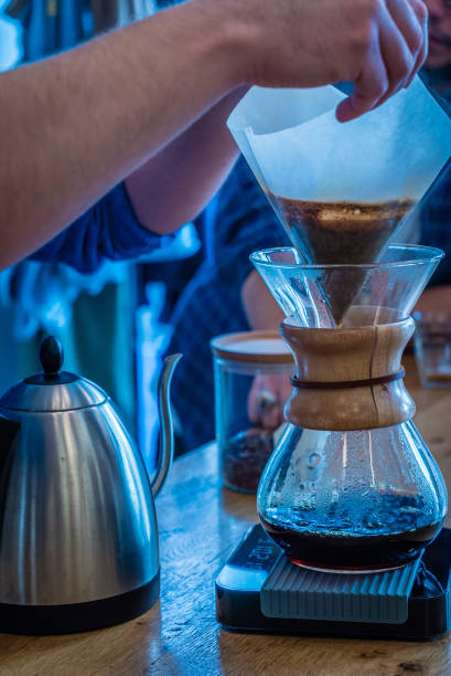 istock Barista filtering black coffee 899255132