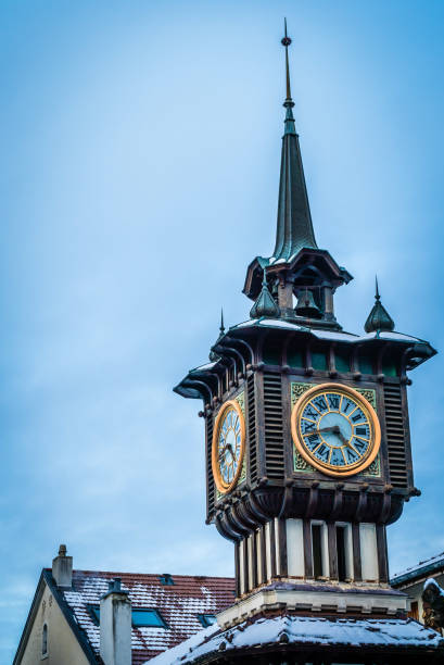Bell tower of Evian-les-bains Close-up shot of the Bell tower in Evian-les-bains in France evian les bains stock pictures, royalty-free photos & images