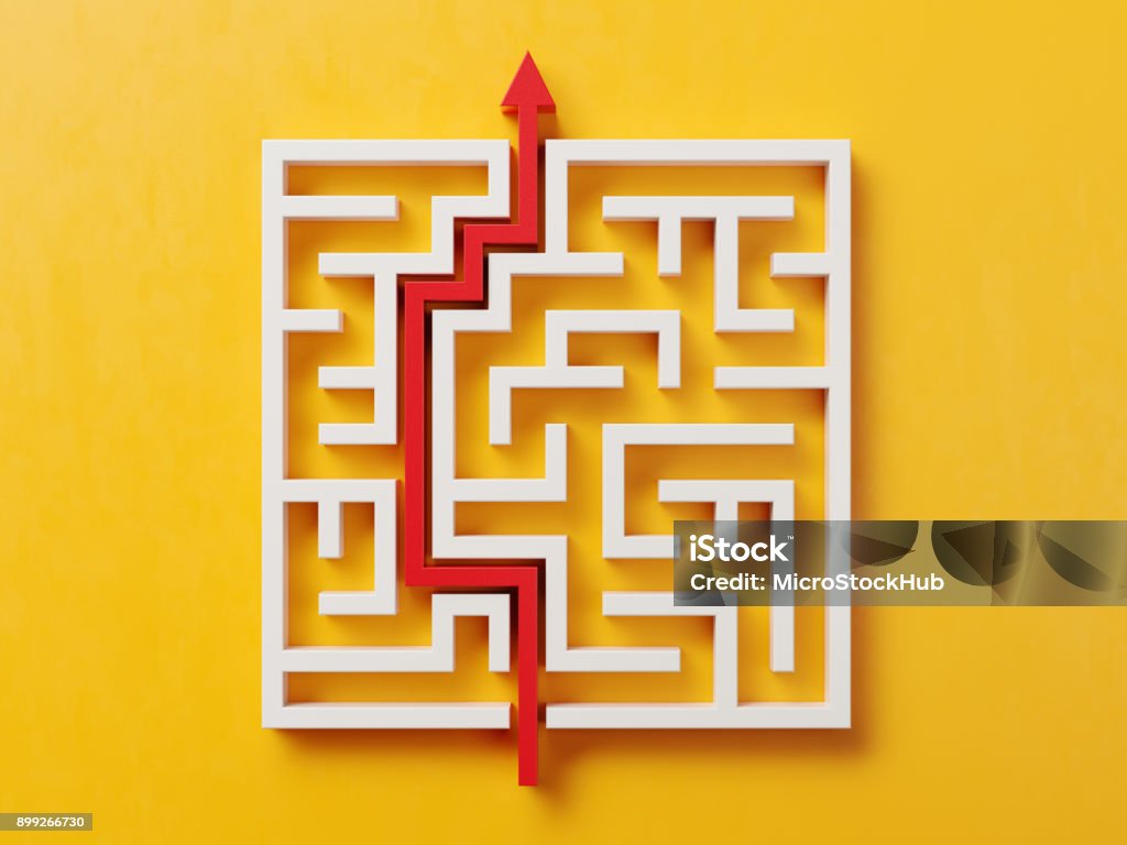 Red Path Across A White Maze On Yellow Background Red path across a white maze on yellow background. Horizontal composition with copy space and clipping path. Directly above. Maze Stock Photo