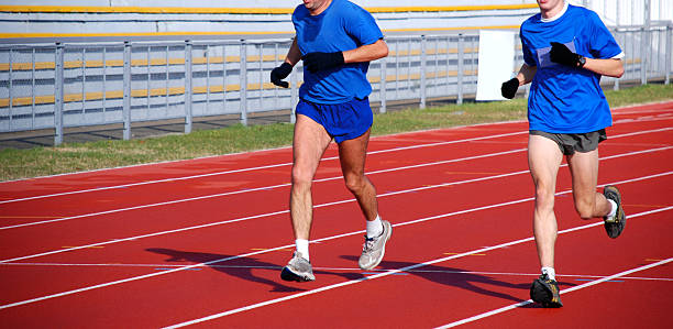 istock runners on the running track 89926910