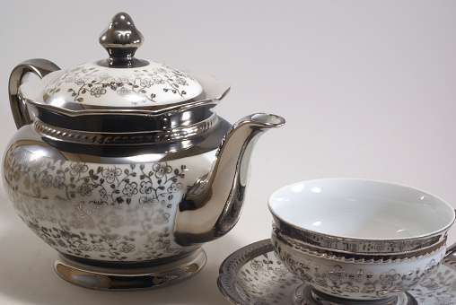Elegant porcelain on the dining table, ceramic tableware, tea cups