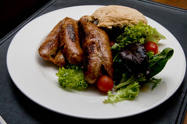 Sausage with salad and bread stock photo