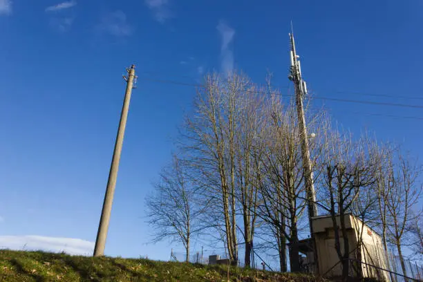 cellphone radiomast on december sunny blue sky in south germany rural countryside near city munich stuttgart