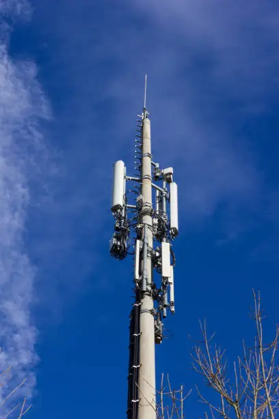 cellphone radiomast on december sunny blue sky in south germany rural countryside near city munich stuttgart