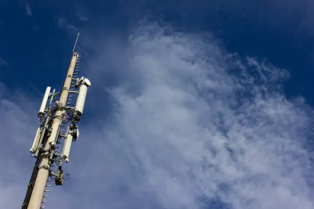 cellphone radiomast on december sunny blue sky in south germany rural countryside near city munich stuttgart