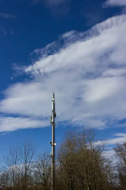 cellphone radiomast on december sunny blue sky in south germany rural countryside near city munich stuttgart