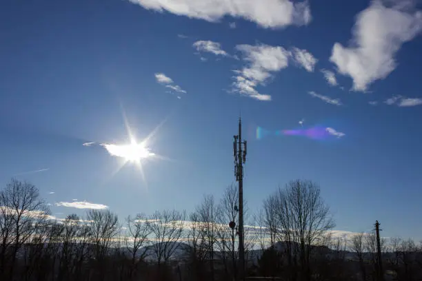 cellphone radiomast on december sunny blue sky in south germany rural countryside near city munich stuttgart