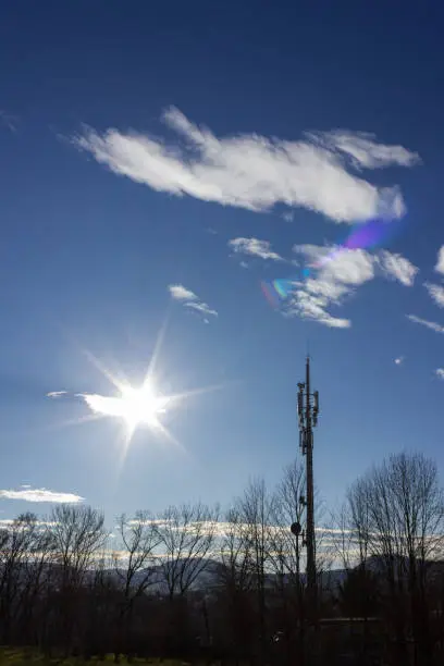 cellphone radiomast on december sunny blue sky in south germany rural countryside near city munich stuttgart