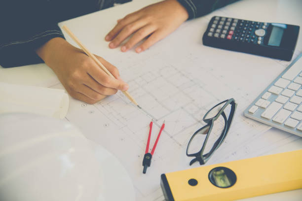 istock Team of engineers working together in a architect office. 899284580