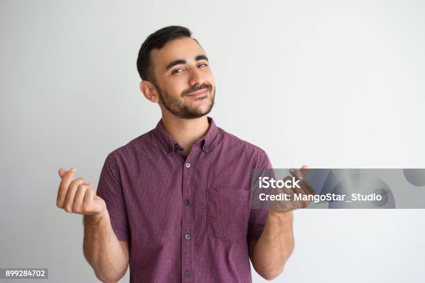 Content Man Rubbing Fingers And Asking For Money Stock Photo - Download Image Now - Currency, People, Men