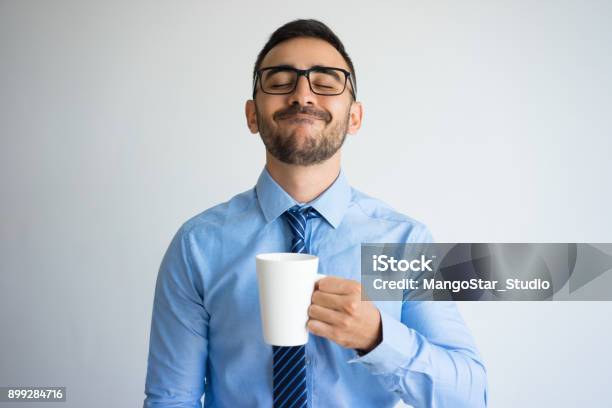 Content Business Man Enjoying Drinking Tea Stock Photo - Download Image Now - Men, Mug, Humor