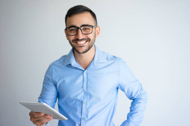 istock Happy Handsome Business Man Holding Tablet 899284742