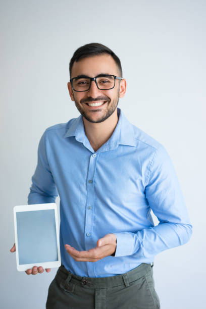 istock Happy Handsome Business Man Presenting Tablet 899284768