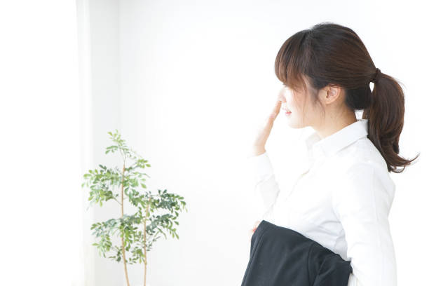 istock business woman putting off suit 899285290