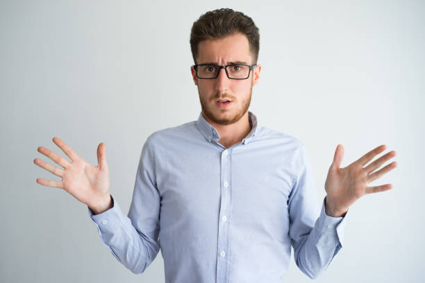 istock Upset or confused businessman shrugging shoulders 899287410