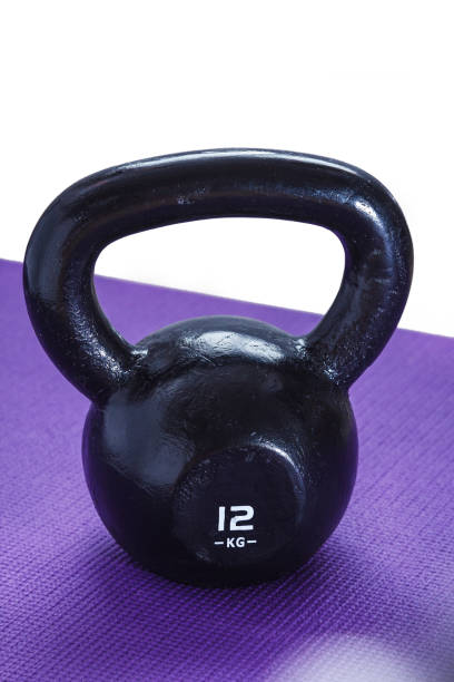 istock Kettlebell on yoga mat 899288478