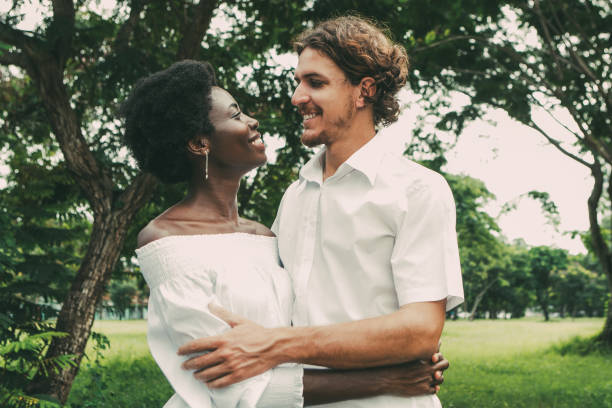 portrait of happy young couple walking in park - wedding african descent american culture bride imagens e fotografias de stock