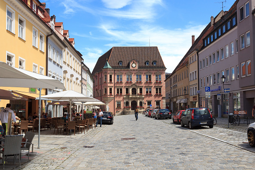 Kaufbeuren, Germany - July 29, 2017: Pedestrian zone with shops and people in old town Kaufbeuren. Kaufbeuren is an independent town in the Regierungsbezirk of Swabia, Bavaria.