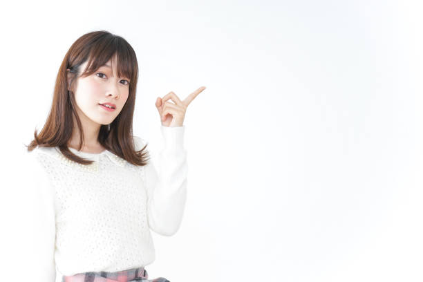 istock Young woman pointing to something 899295426