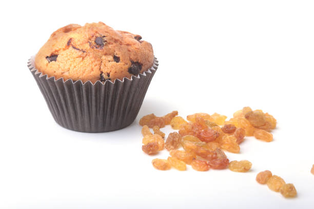 Homemade muffin with raisins and chocolate cupcake. Isolated on white background. selective focus