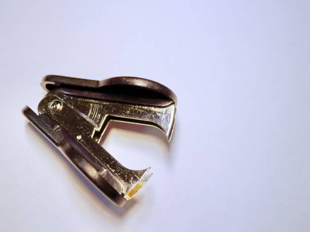 istock shiny office anti-stapler on white background 899295970