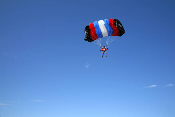istock Parachutist on the blue sky 89929818