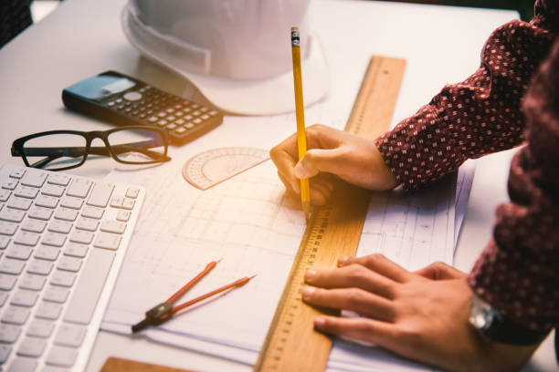istock Team of engineers working together in a architect office. 899300088