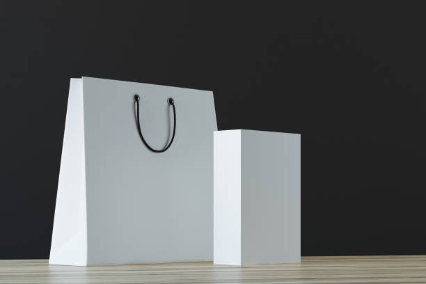 istock White paper bag and box, black background 899300172
