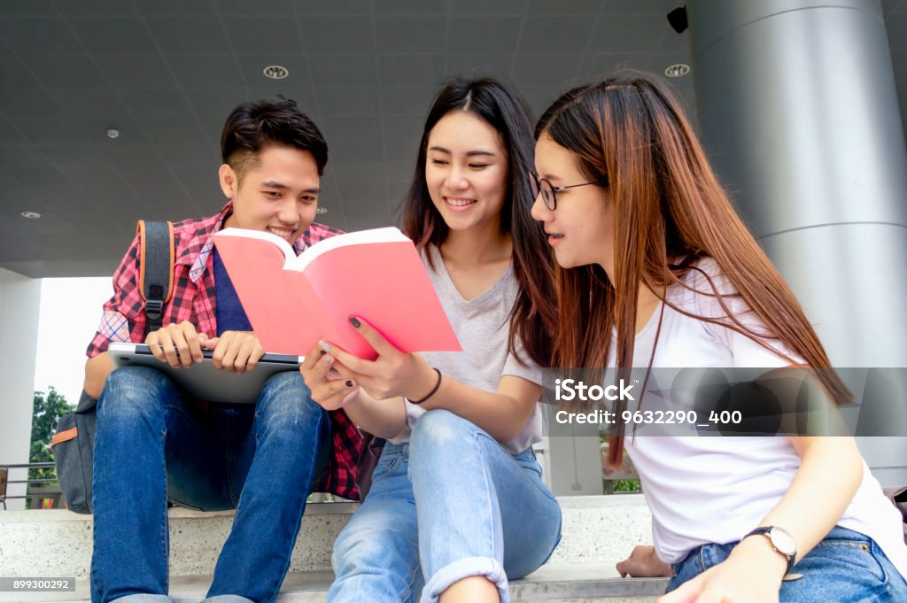 Group of young asian studying in university sitting during lecture education students college university studying youth campus friendship teenager teens concept. Adult Stock Photo