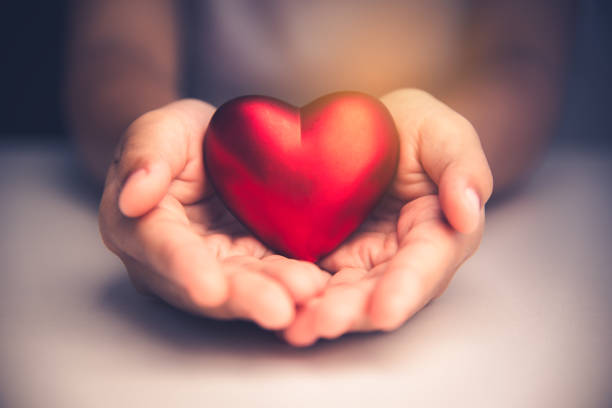 istock Hand give red heart for love 899300528