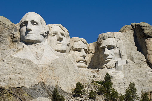 View of the four presidents at Mount Rushmore with full face of George Washington and side views of the others.