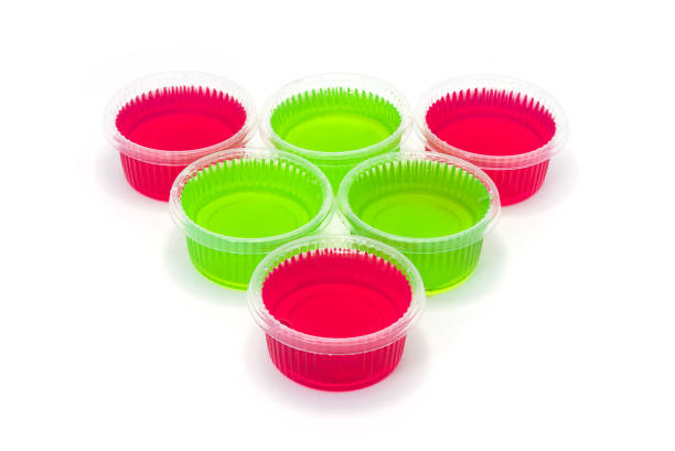 Red and Green jelly in cup on white background.