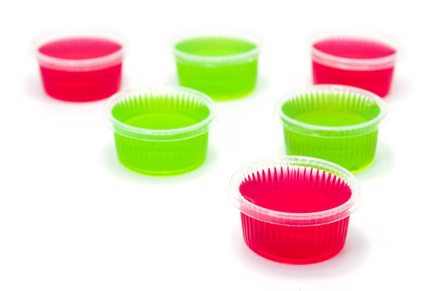 Red and Green jelly in cup on white background.