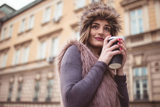 istock Happy woman with coffee on the go 899313174