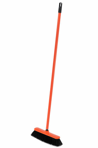 istock Red broom isolated on white background 899316358